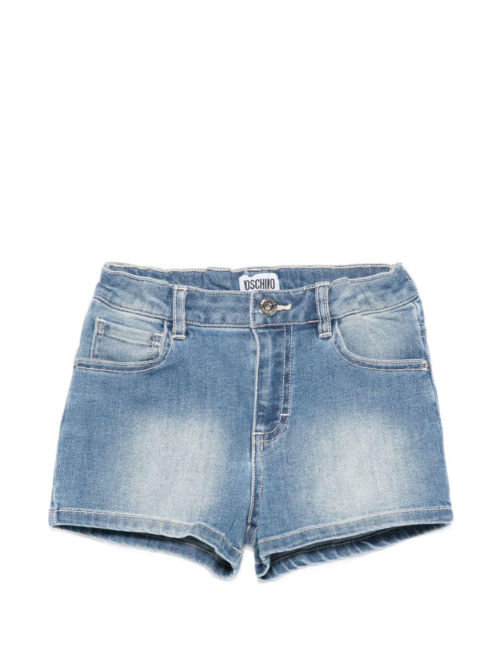 Shorts per bambina Moschino Kids in denim con stampa grafica sul retro HDQ01XLXE62 40386 MOSCHINO KIDS