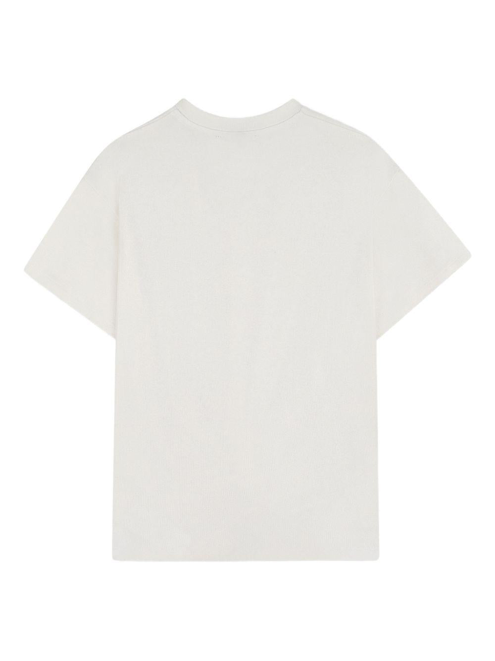 T-shirt per bambina DKNY Kids bianca con design attorcigliato D62629 560 DKNY