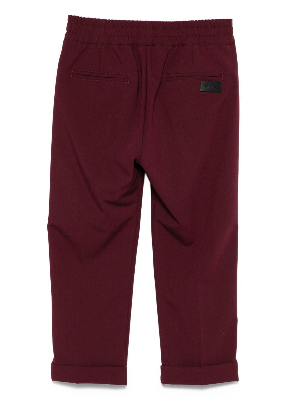 Pantaloni per bambini MSGM Kids bordeaux con elastico in vita e orli svasati F5MSJUPA054 MS045 MSGM KIDS