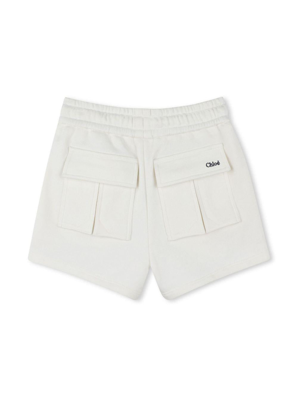 Shorts per bambina Chloé Kids bianco in cotone biologico e logo sul retro C20464 117 CHLOE' KIDS