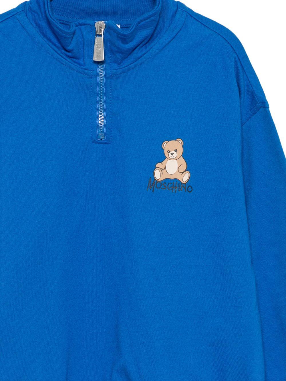 Felpa per bambino Moschino Kids blu con mezza zip HUF0A0LCA94 40157 MOSCHINO KIDS