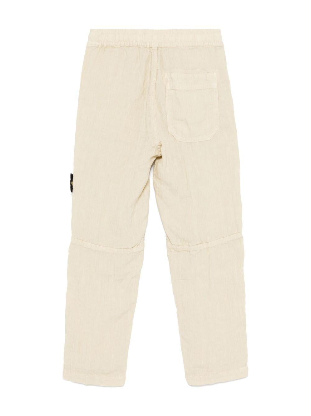Pantaloni per bambino Stone Island Junior beige con applicazione Compass K1S163100002S0145 V0095 STONE ISLAND JUNIOR