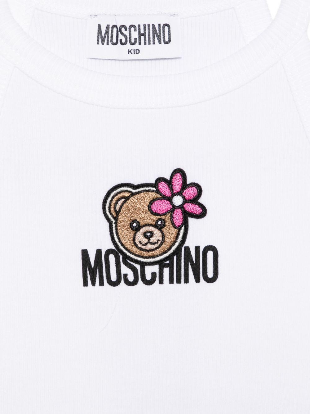 Top per bambina Moschino Kids bianca con stampa Teddy Bear con fiore HDM06ZLBA39 10101 MOSCHINO KIDS