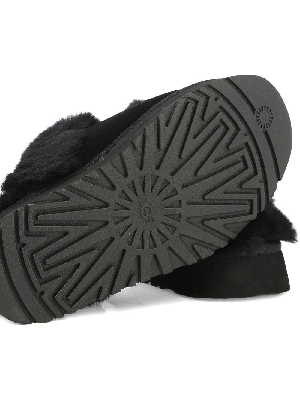 Slippers per bambina UGG Kids Disquette nero con finitura in pelliccia sintetica 1122550 BLK UGG