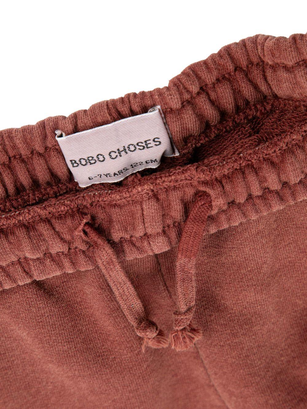 Pantaloni sportivi per bambino Bobo Choses marrone con logo sul davanti B126AC084 211 BOBO CHOSES KIDS