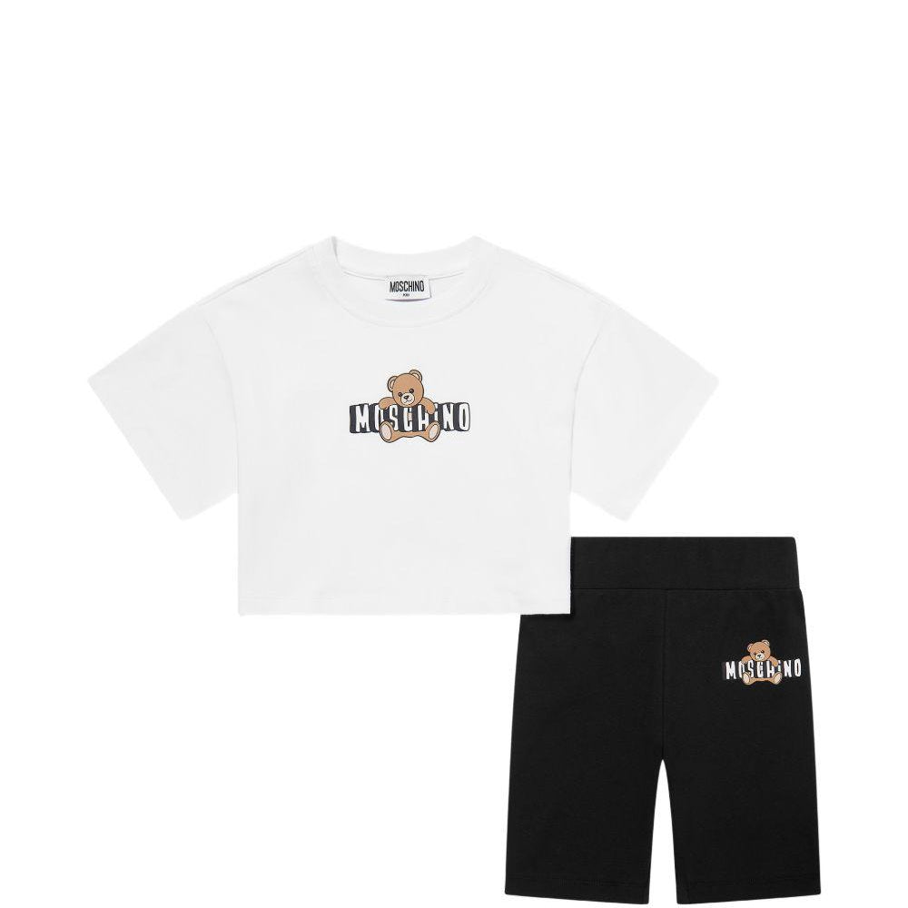 Set t-shirt e shorts per bambina Moschino Kids bianco e nero con motivo Teddy Bear HAG01HLBA00 80359 MOSCHINO KIDS