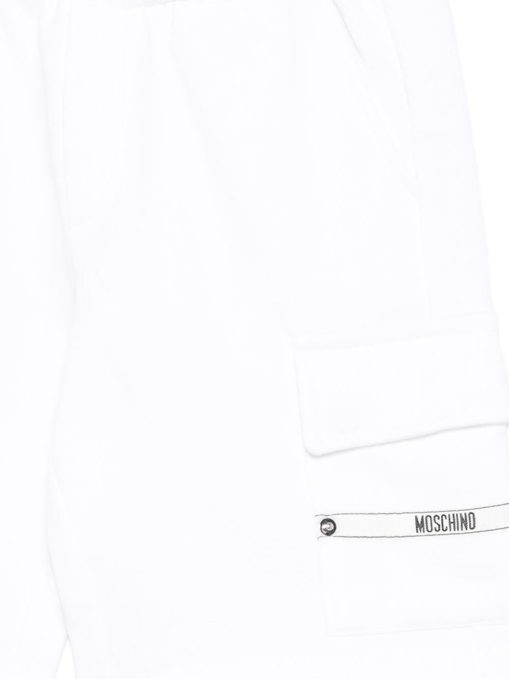 Shorts per bambino Moschino Kids bianco con dettaglio logo sulla tasca HUQ02OLCA86 10101 MOSCHINO KIDS