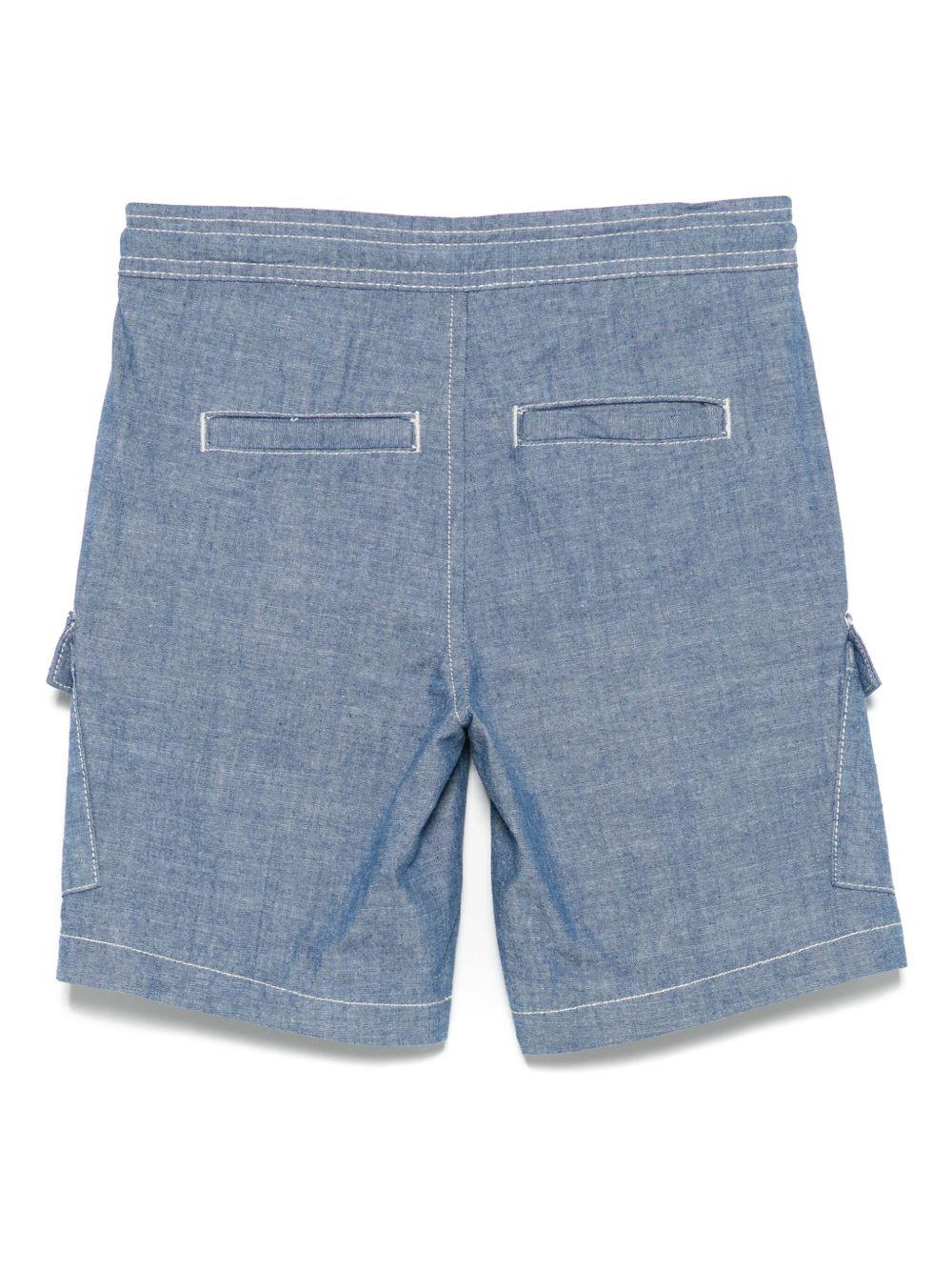 Shorts per bambino Trussardi Junior blu con applicazione logo e due tasche cargo frontali TBP25160BE DENIM STONEWASH TRUSSARDI JUNIOR