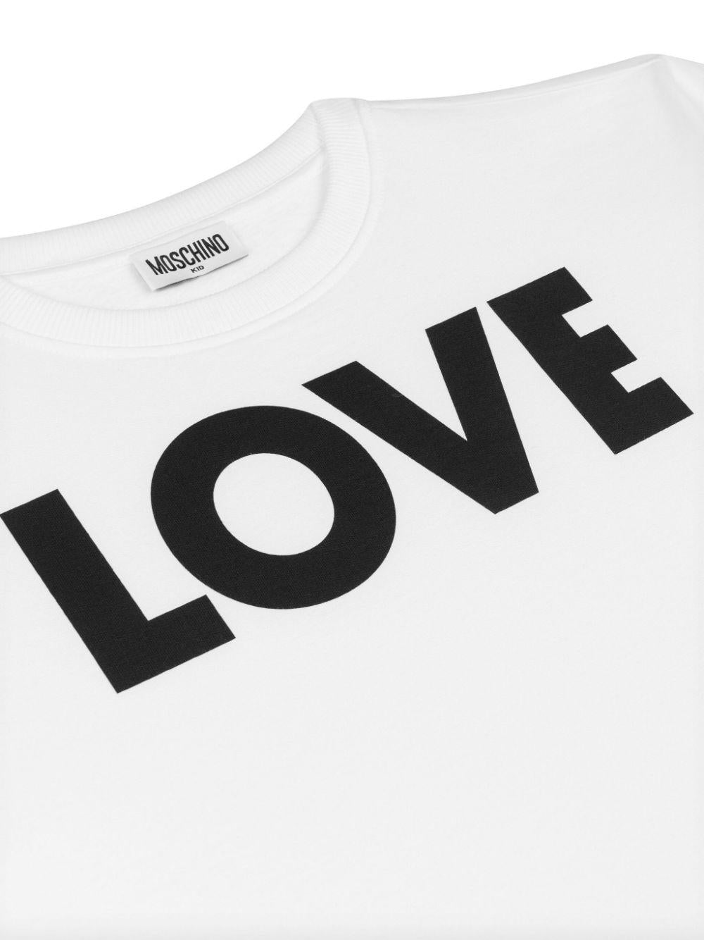 T shirt per bambina bianca Moschino con stampa LOVE nera HDV0FULCA61 10101 MOSCHINO KIDS