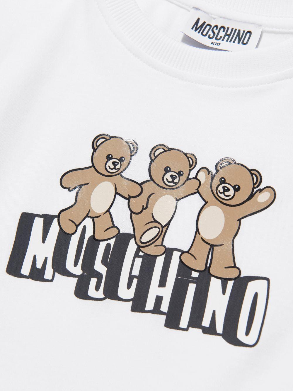 T-shirt per bambini Moschino Kids bianca con stampa grafica tre Teddy Bear HUM05PLAA23 10101 MOSCHINO KIDS