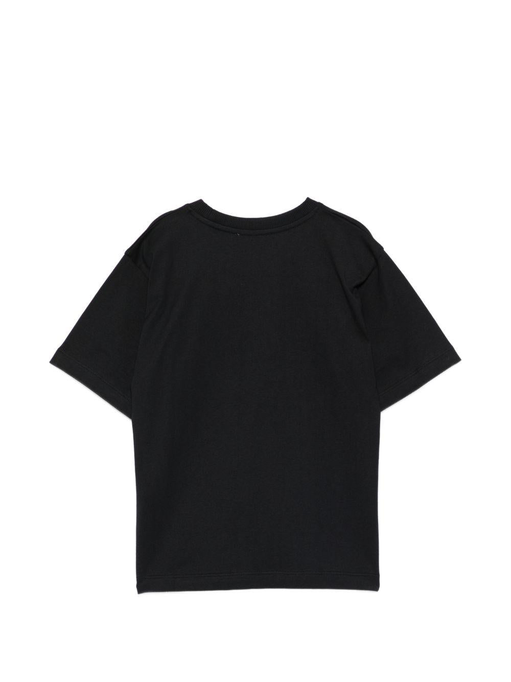 T-shirt per bambini Moschino Kids nera con logo sul davanti H5M05GLAA23 60100 MOSCHINO KIDS