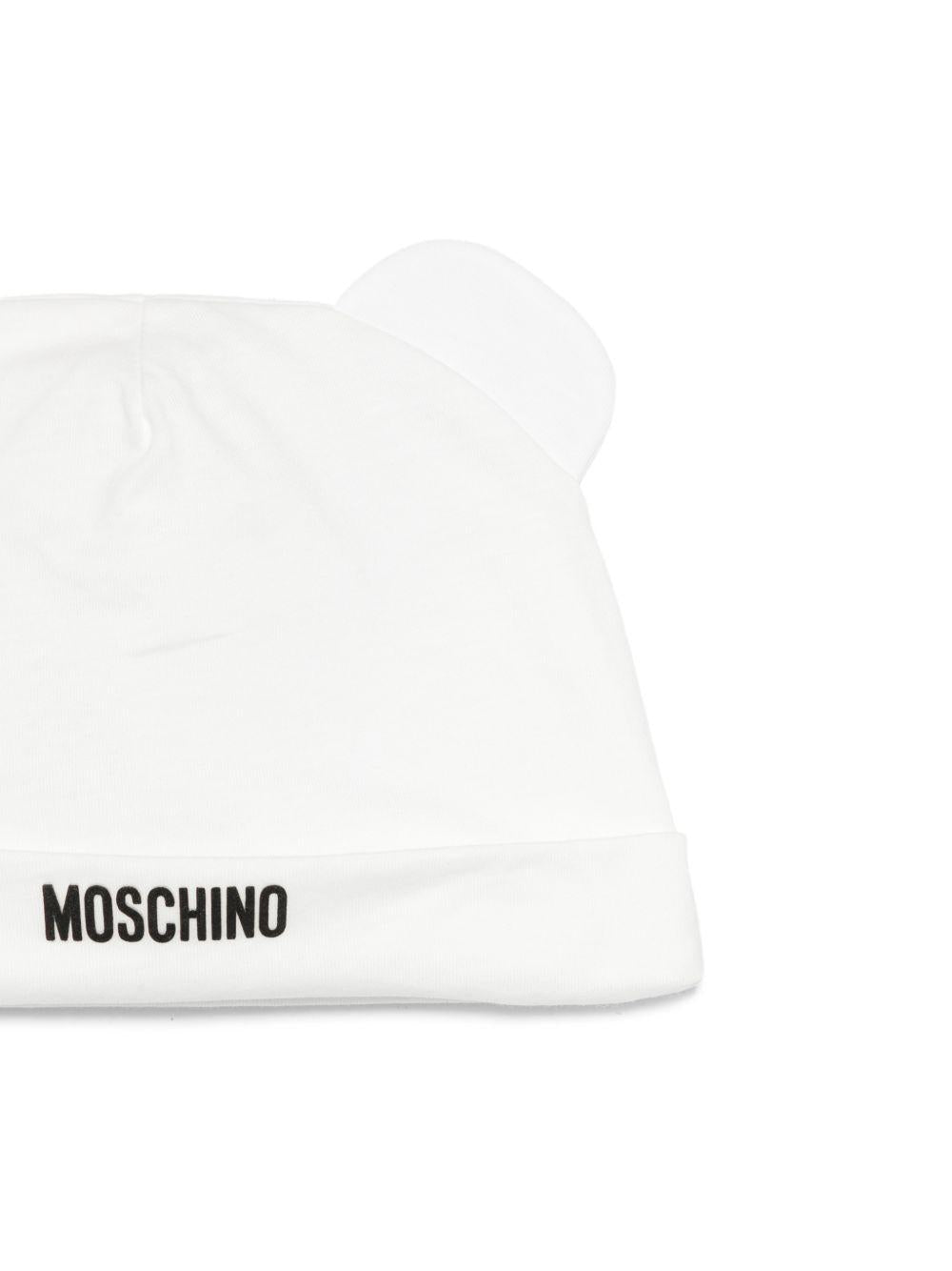 Set tutina e cappellino per neonati Moschino Kids bianco con stampa Teddy Bear MUY090LAA01 10063 MOSCHINO KIDS