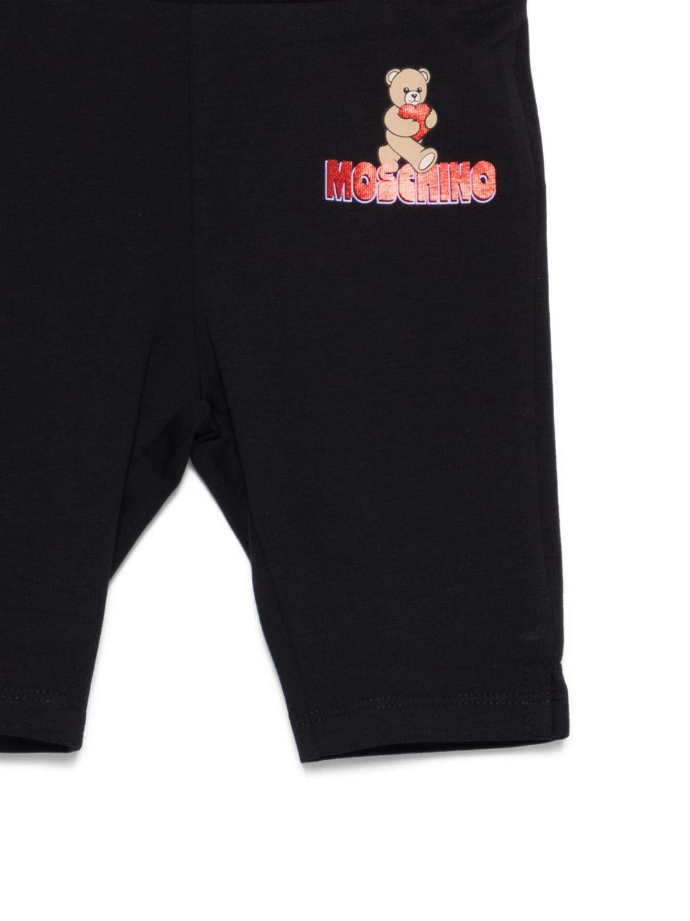 Leggins per neonata Moschino Kids neri con logo sul davanti MDP03JLBA00 60100 MOSCHINO KIDS