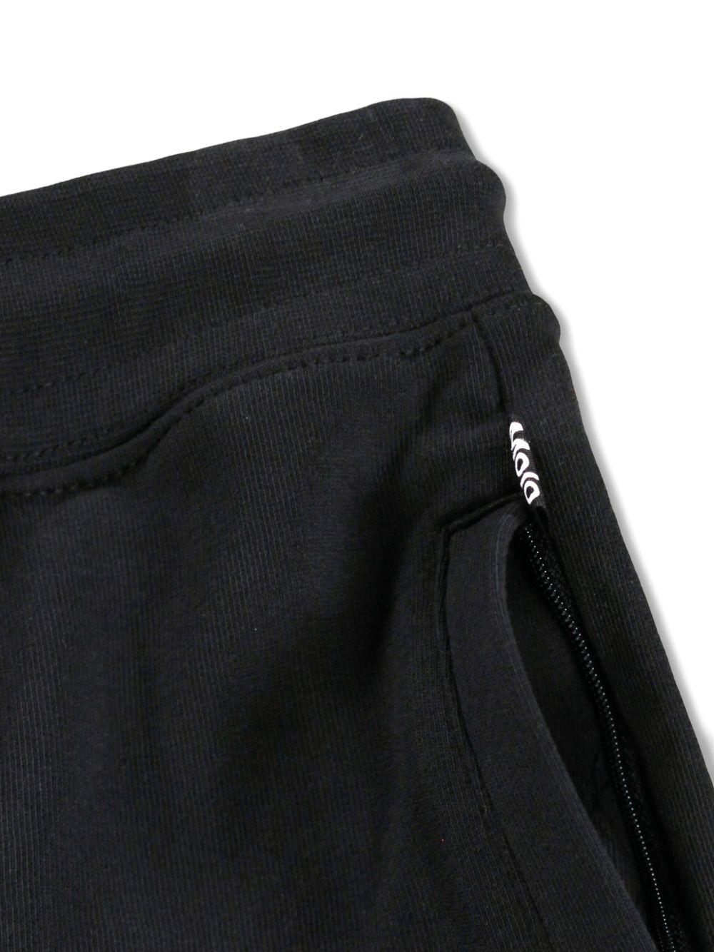 Pantaloni Alvar per bambino Molo neri con quadrante con smiley 6S26I201 0099 MOLO KIDS