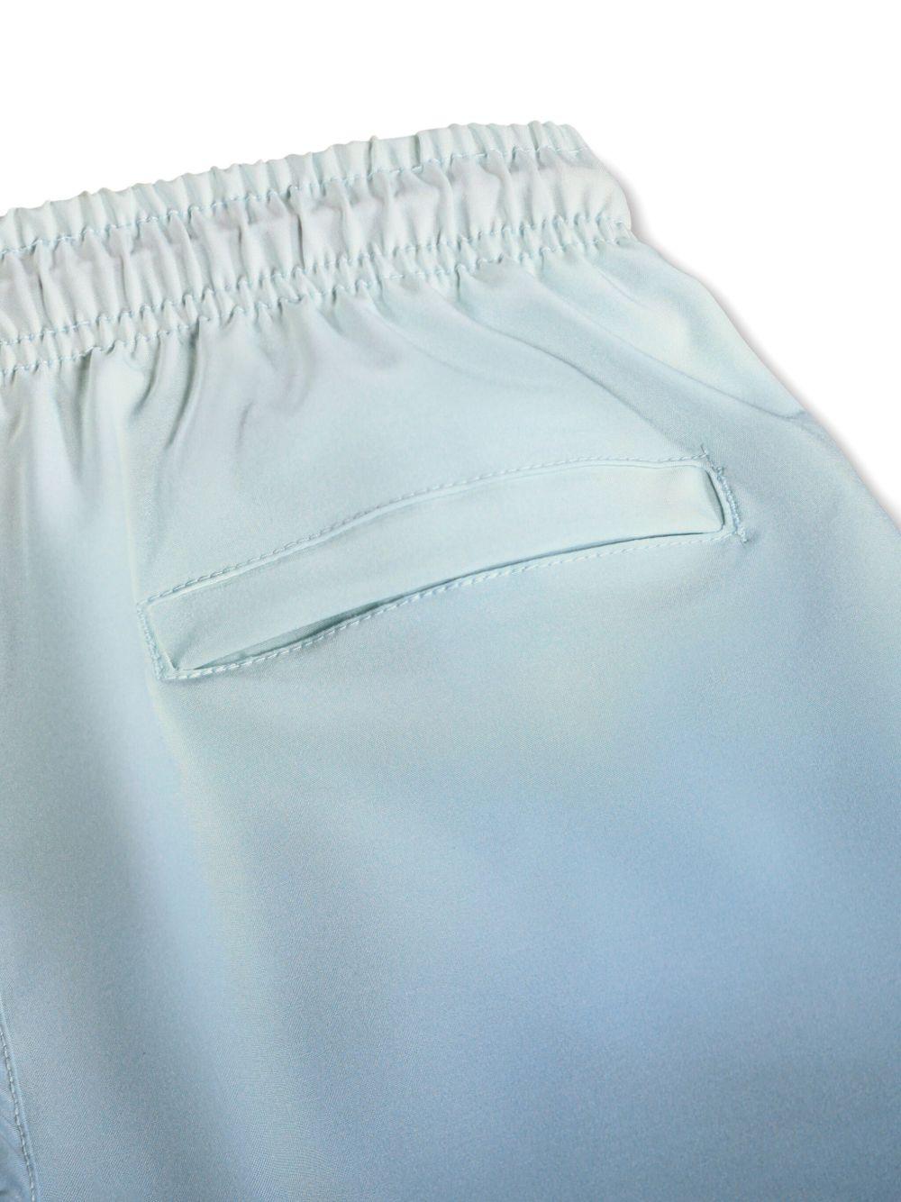 Costume da bagno per bambino Molo Niko azzurro con stampa palme 8S26P402 5707 MOLO