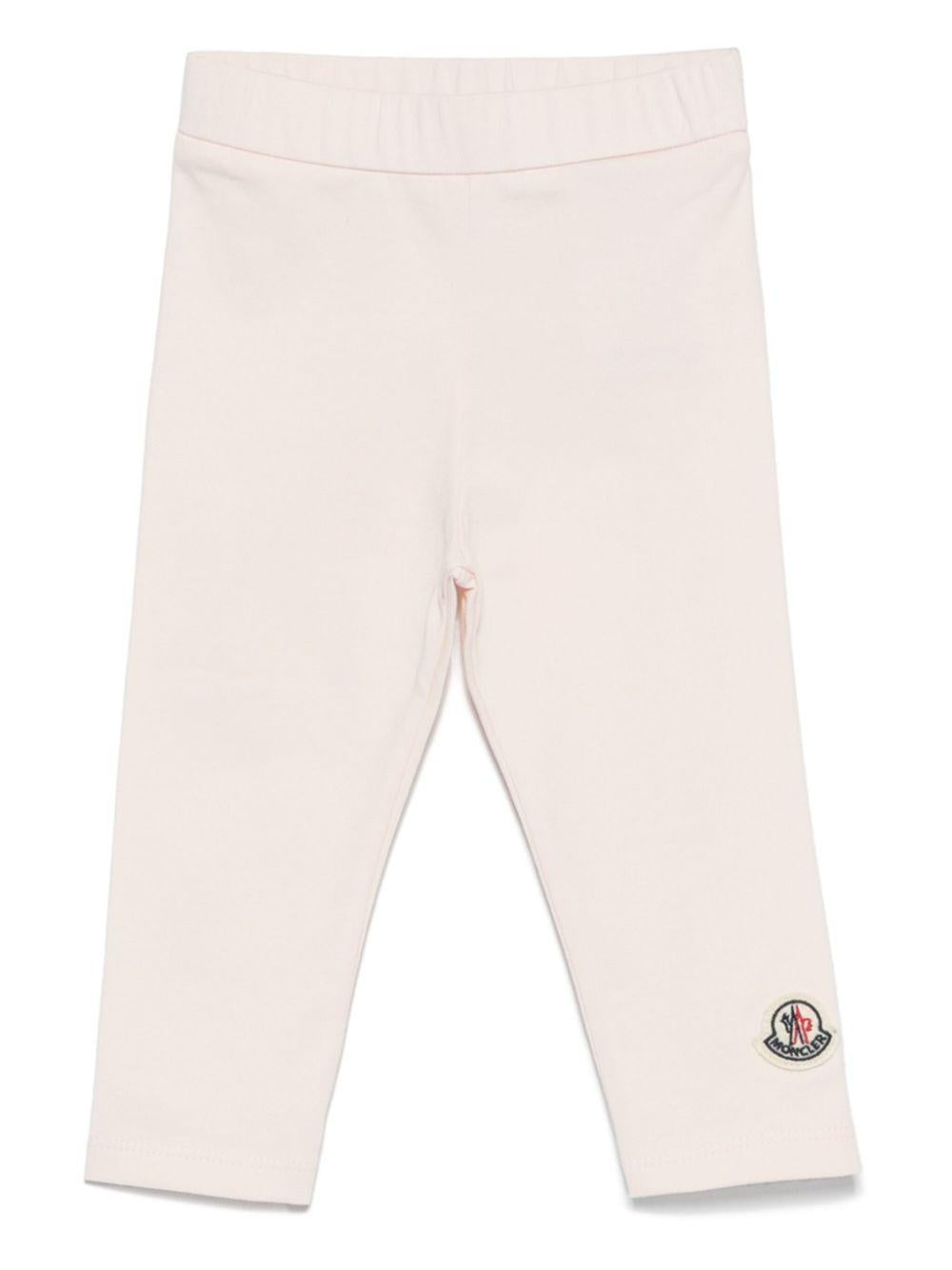 Leggings per neonata Moncler Enfant rosa con applicazione logo sulla gamba K19518H0000289AUM 529 MONCLER ENFANT