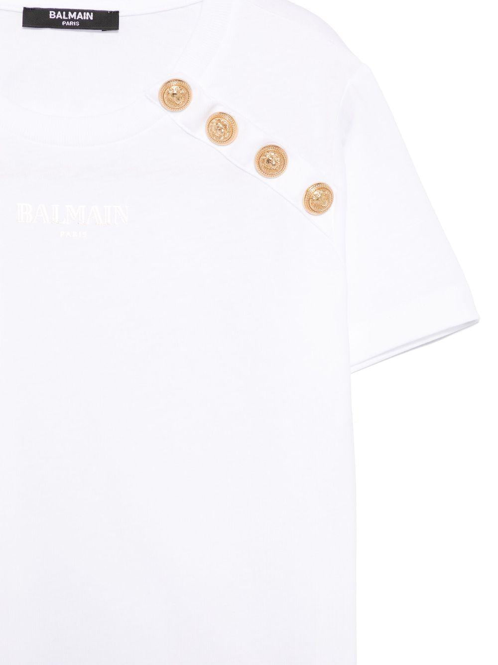 T-shirt con stampa logo per bambina Balmain Kids bianco con bottoni goffrati color oro BW8P71 Z1751 100OR BALMAIN KIDS