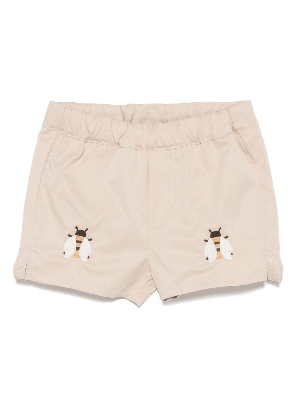 Costume da bagno per neonato Donsje Mees beige con spacchetti laterali 4068301 004ZK DONSJE
