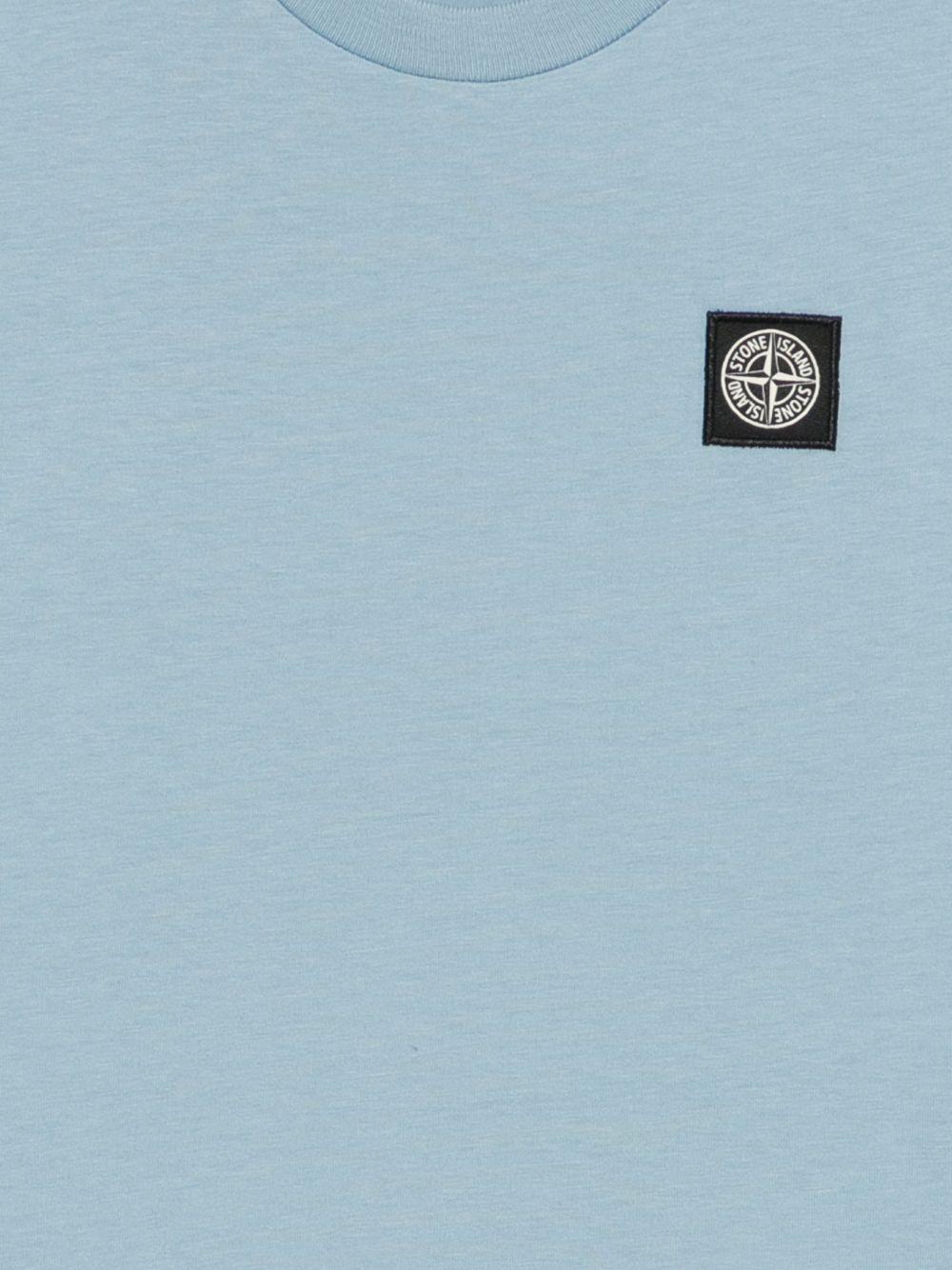 T-shirt per bambino Stone Island Junior azzurra con toppa con logo L1S162100002S0047 V004A STONE ISLAND JUNIOR