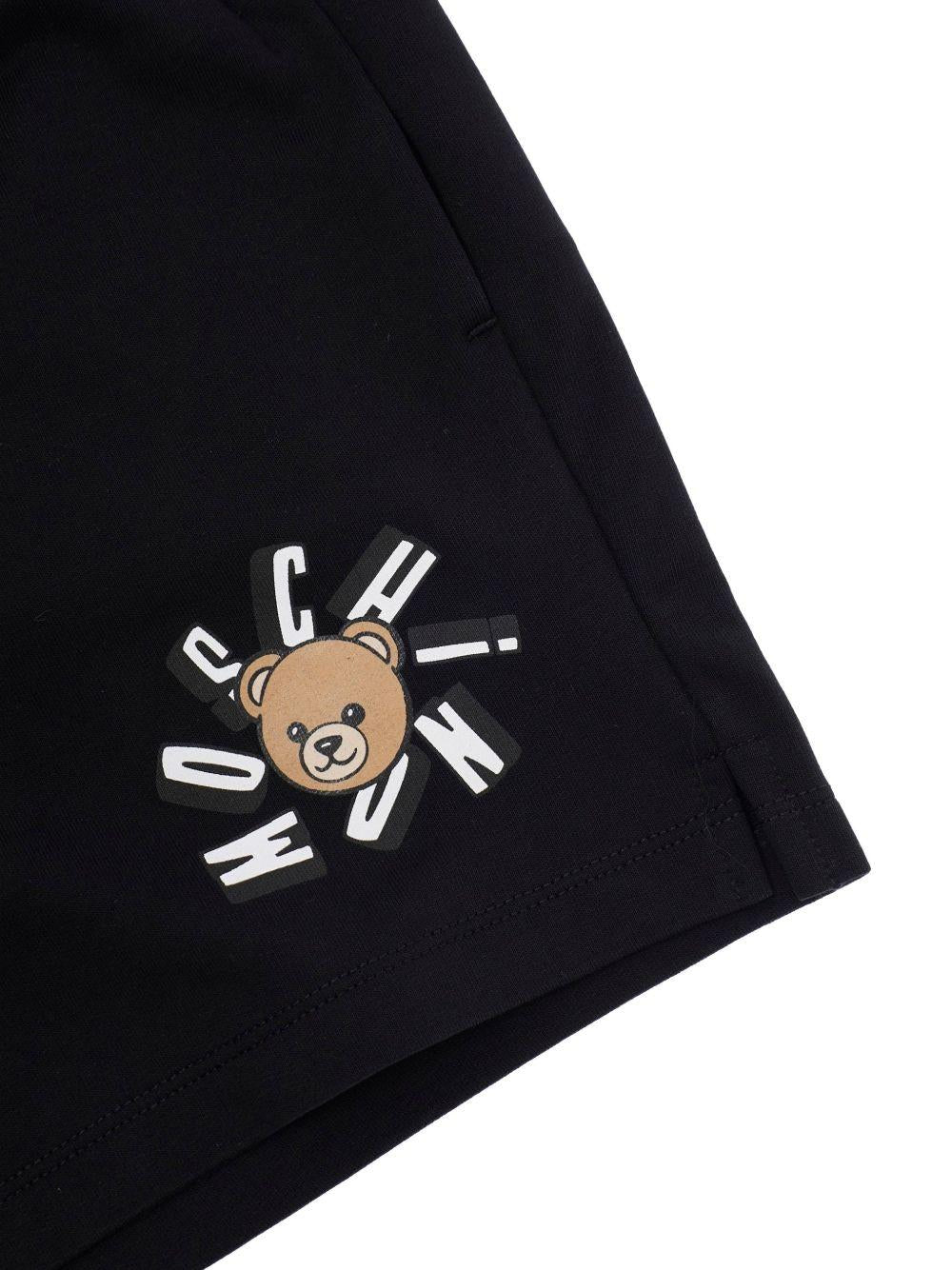 Shorts da bambina Moschino Kids nero con stampa logo HDQ025LCA19 60100 MOSCHINO KIDS