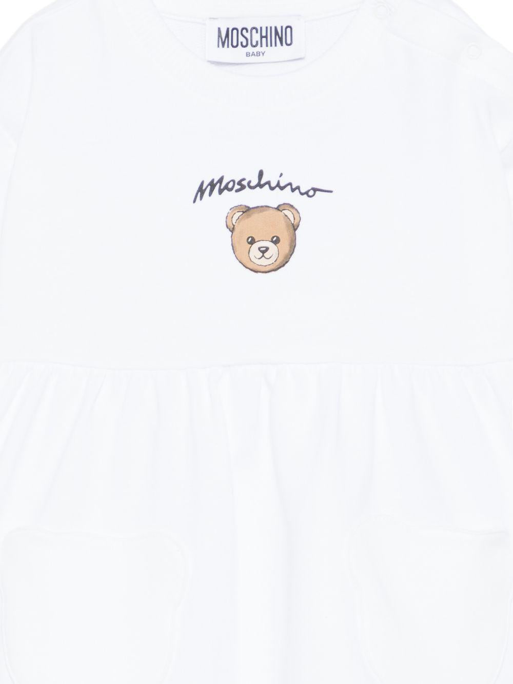 Abito per neonata Moschino Kids bianco con dettaglio orsetto MDV0DGLCA19 10101 MOSCHINO KIDS