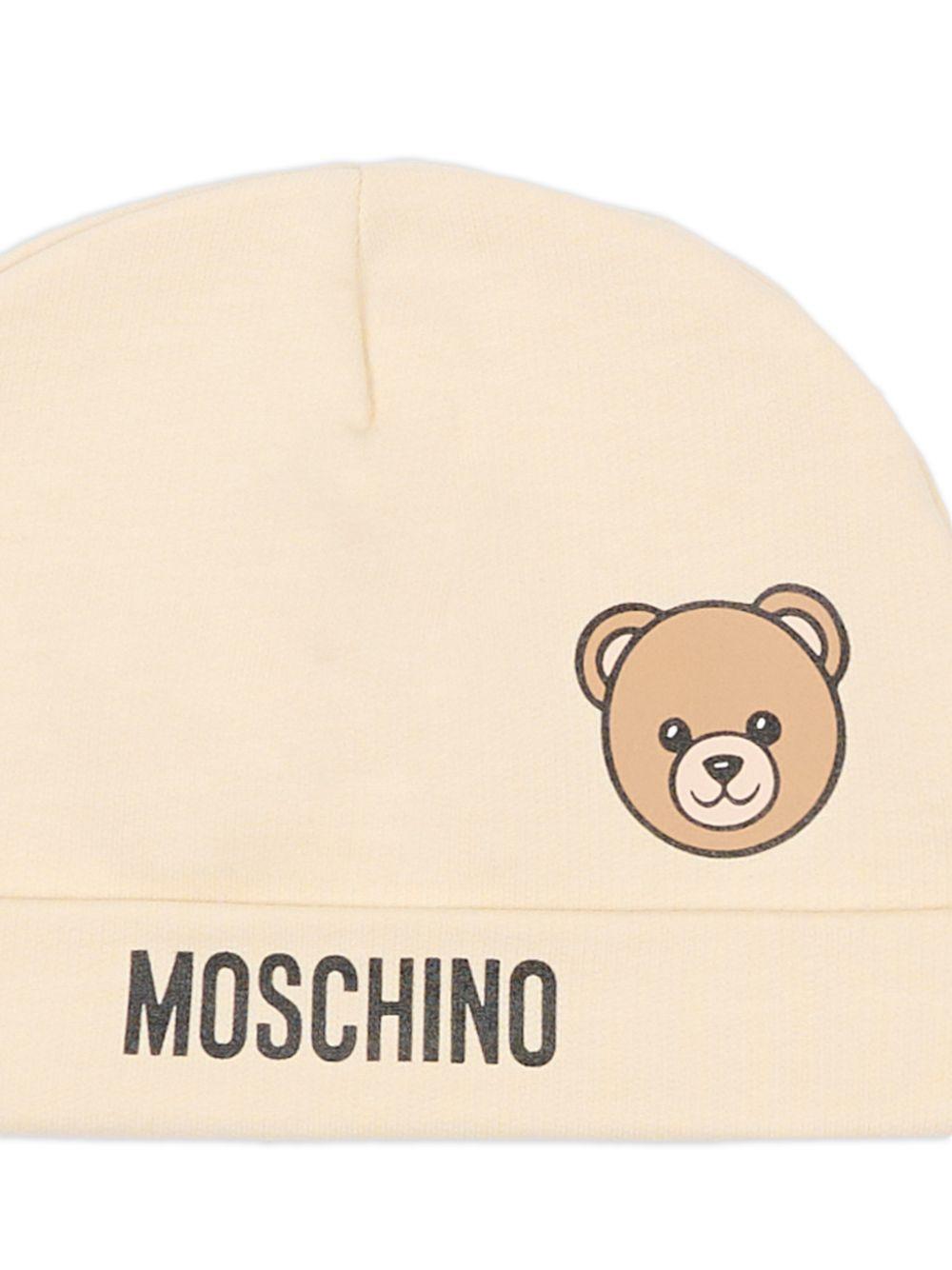 Berretto per neonati Moschino Kids beige con motivo orsetto MUX05ULCA19 20404 MOSCHINO KIDS