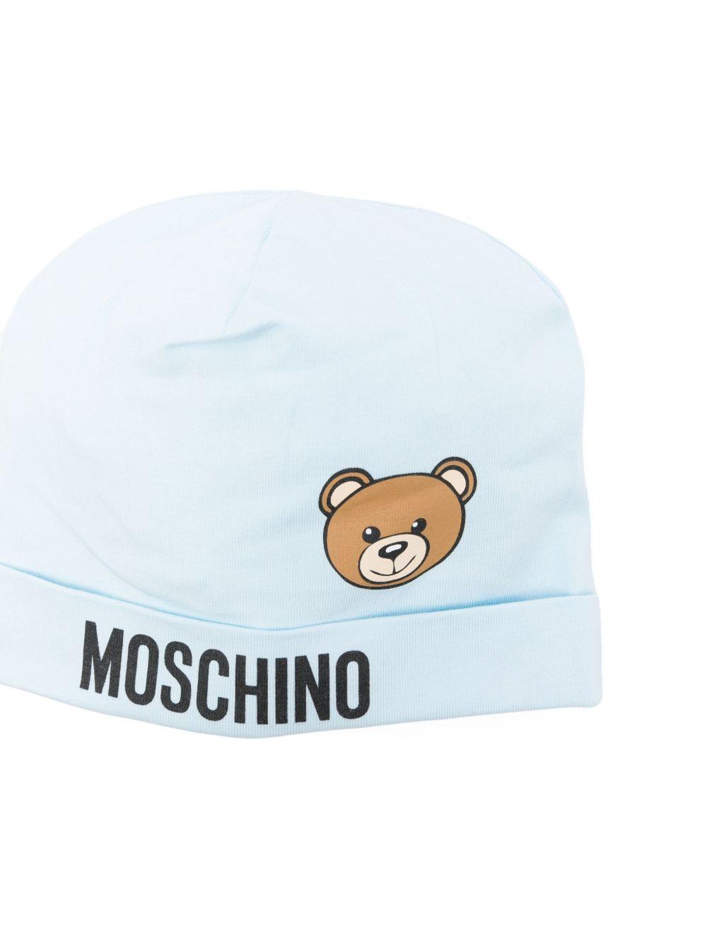 Cappello per neonato Moschino Kids azzurro con stampa logo e Teddy Bear MUX05ALBA00 40304 MOSCHINO KIDS