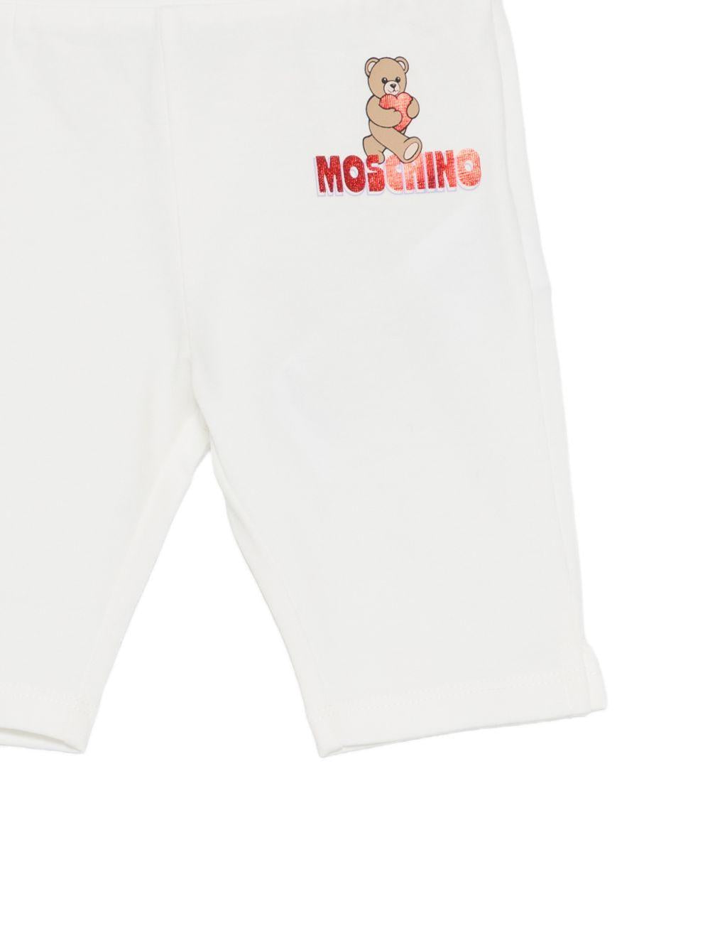 Leggins per neonata Moschino Kids bianchi con logo sul davanti MDP03JLBA00 10063 MOSCHINO KIDS