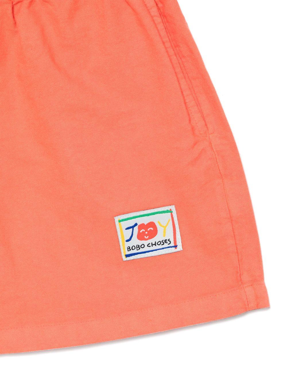 Shorts per bambino Bobo Choses Similing arancione con logo applicato B125AC059 611 BOBO CHOSES