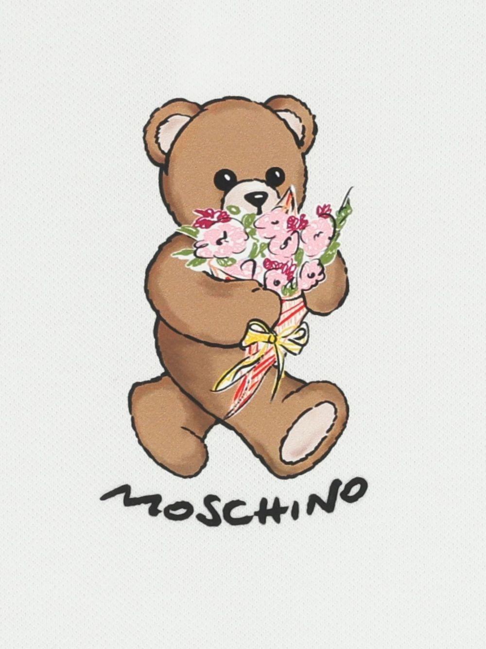 Abito per neonata Moschino Kids bianco con ruches MDV0DILFA06 10101 MOSCHINO KIDS