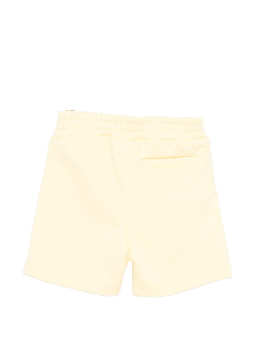 Shorts per neonato Givenchy Kids giallo con dettaglio logo sul davanti H31231 524 GIVENCHY KIDS