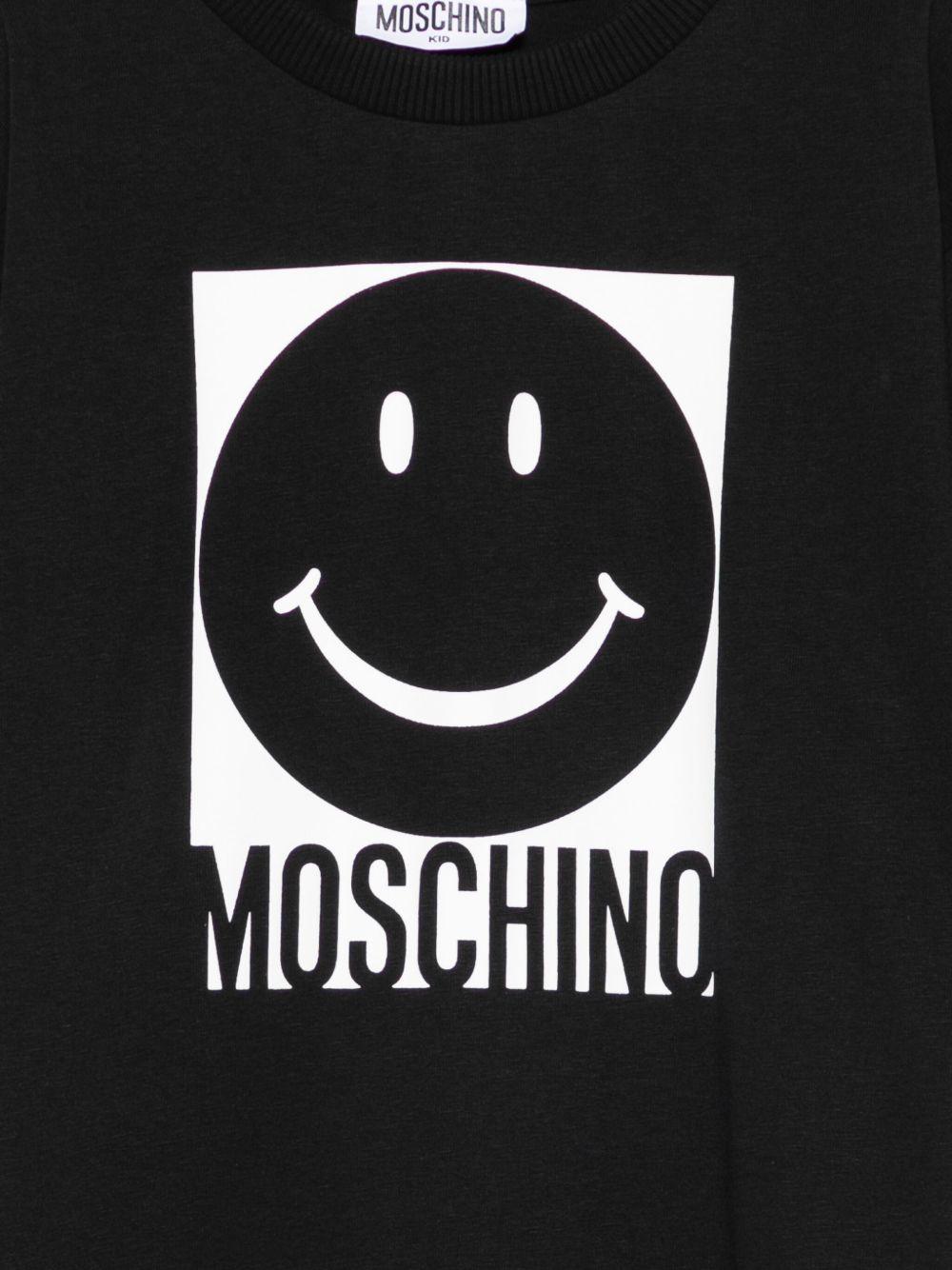 T-shirt per bambino Moschino Kids nero con stampa smiley HSM05GLAA01 60100 MOSCHINO KIDS