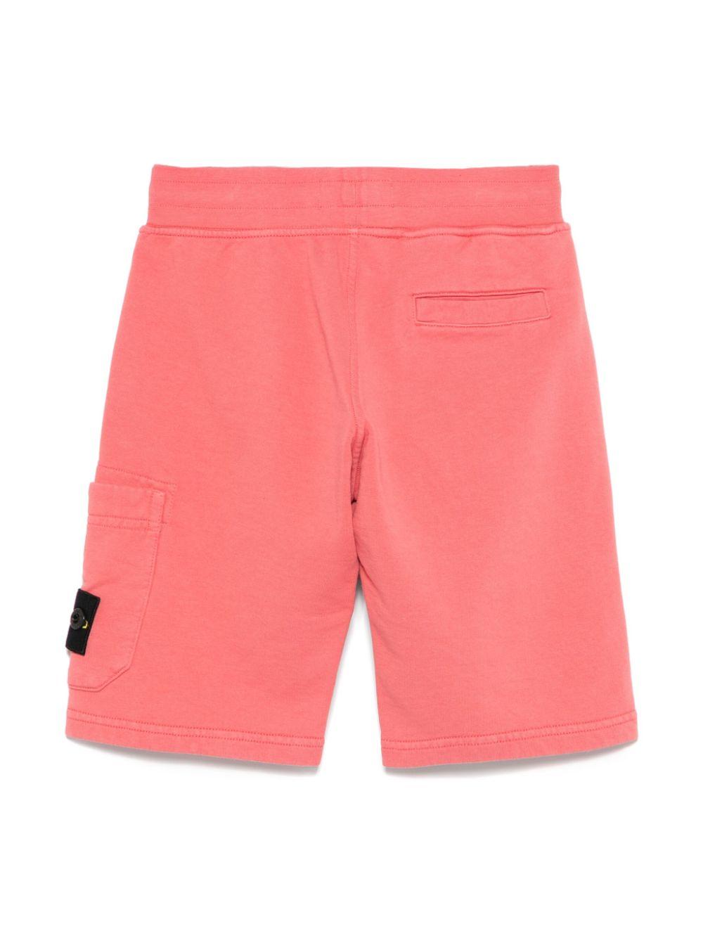 Shorts con applicazione Compass per bambino Stone Island Junior rosa con tasca laterale K1S166200006S0040 V0089 STONE ISLAND JUNIOR
