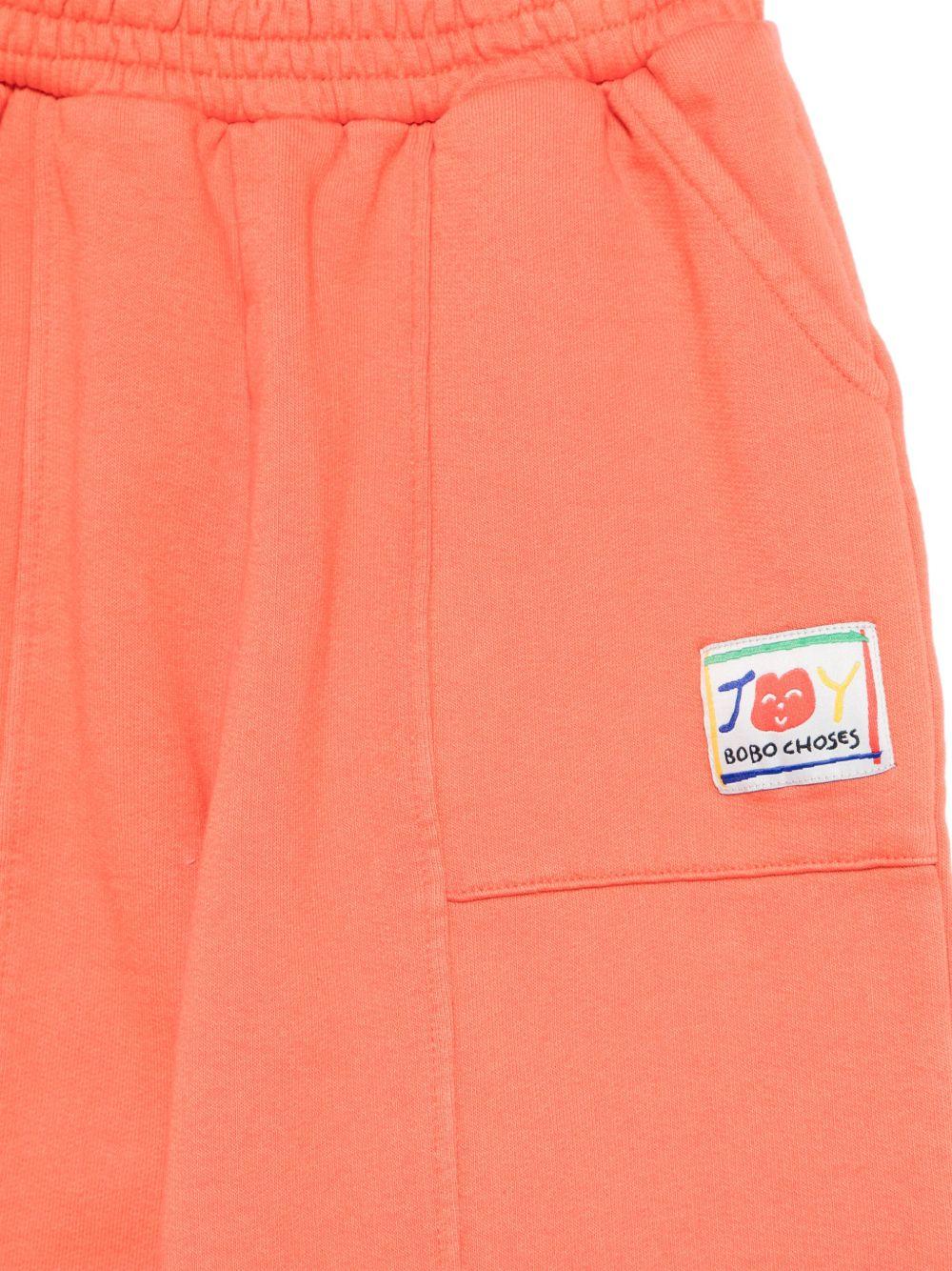 Pantaloni sportivi per bambina Bobo Choses Smiling arancione con vita elasticizzata B125AC078 611 BOBO CHOSES KIDS