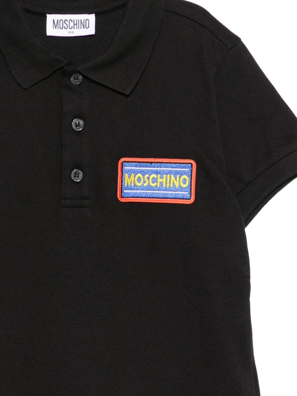 Polo per bambino Moschino Kids nero con targhetta logo HTM03YLFA09 60100 MOSCHINO KIDS