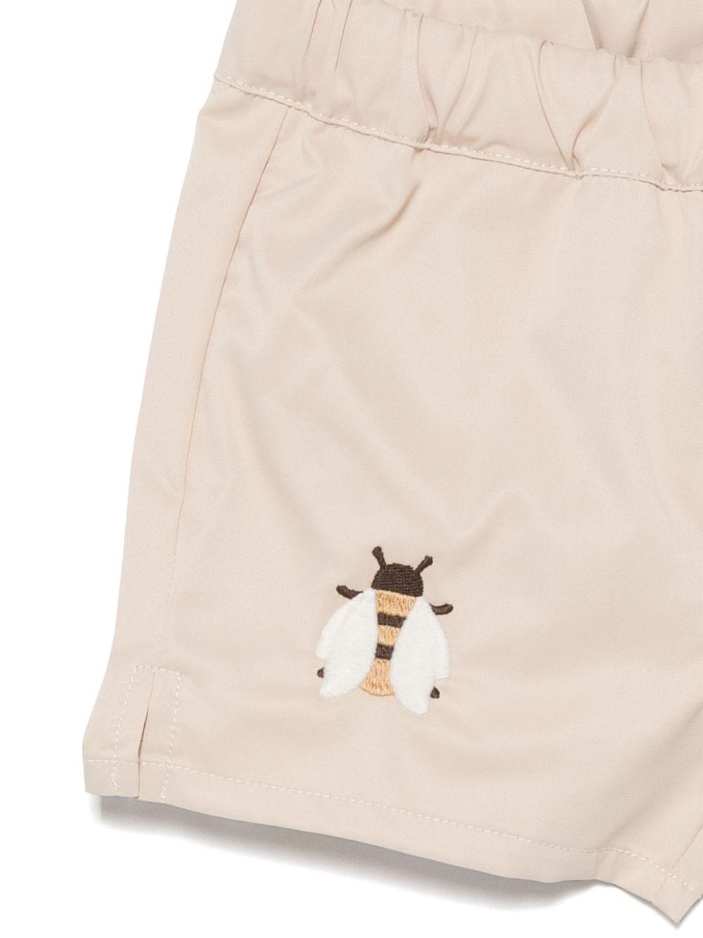 Costume da bagno per neonato Donsje Mees beige con spacchetti laterali 4068301 004ZK DONSJE