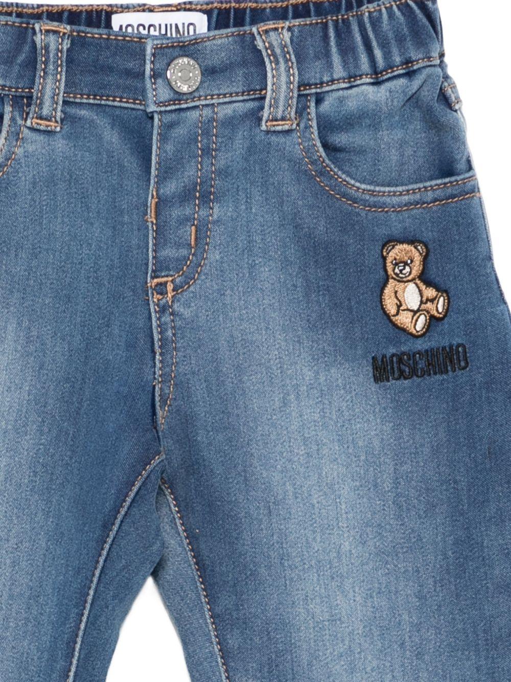 Jeans per neonato Moschino Kids in denim con applicazione Teddy Bear - Rubino Kids