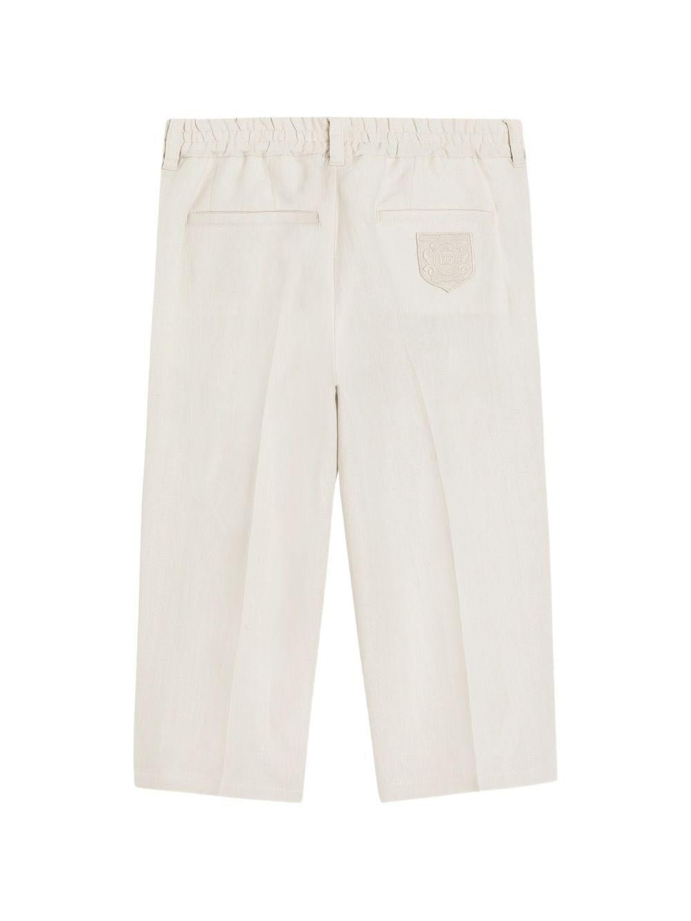 Pantaloni per bambino Dolce & Gabbana Kids beige con logo ricamato sul retro - Rubino Kids