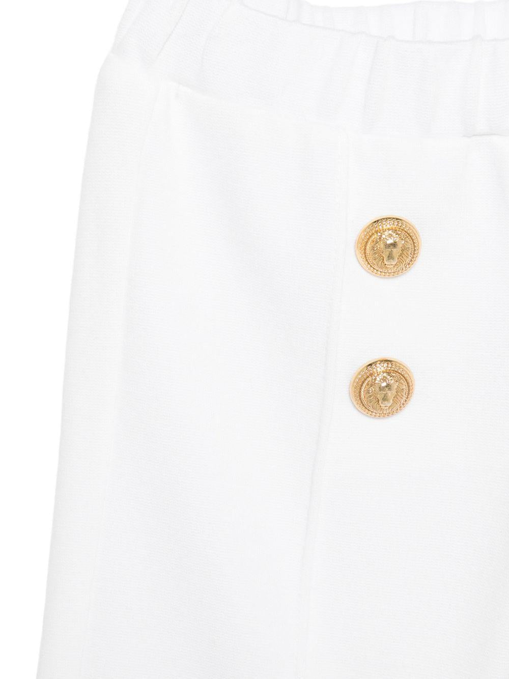 Pantaloni per neonata Balmain Kids bianchi con dettagli bottoni - Rubino Kids