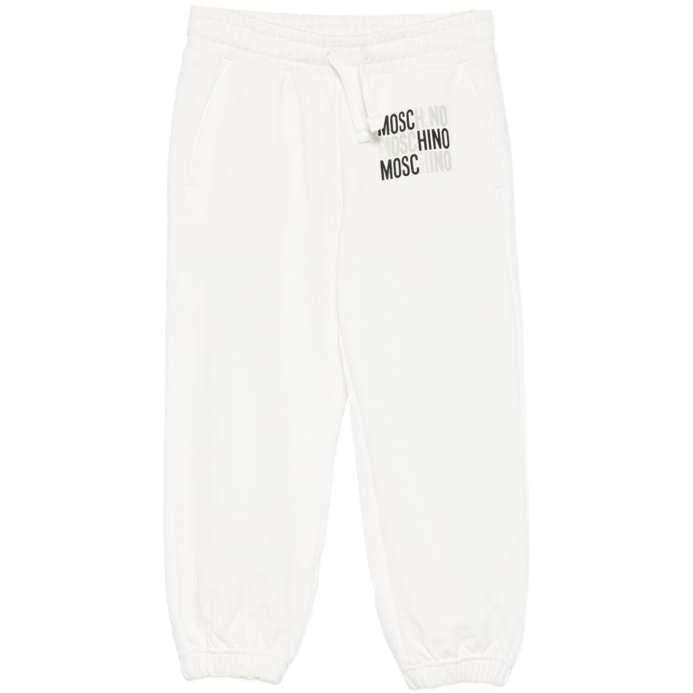Pantaloni sportivi per bambino Moschino Kids bianchi con logo sul davanti - Rubino Kids