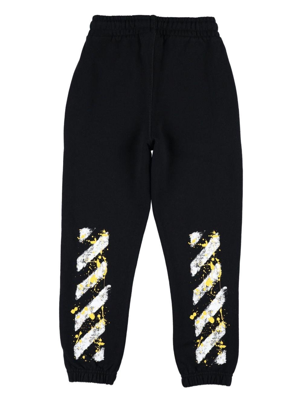 Pantaloni sportivi per bambino Off - White Kids con stampa effetto vernice spray - Rubino Kids