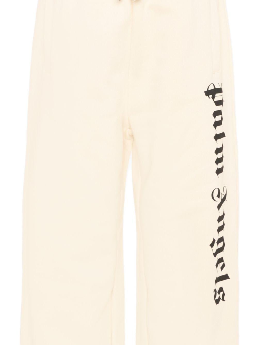 Pantaloni sportivi per bambino Palm Angels Kids beige con logo laterale - Rubino Kids