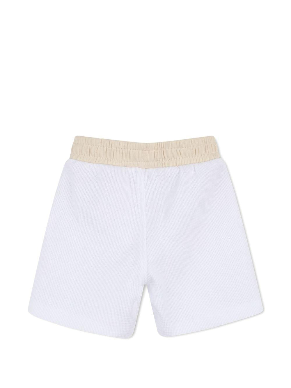 Set polo e shorts per neonato BOSS Kids bianco con logo - Rubino Kids