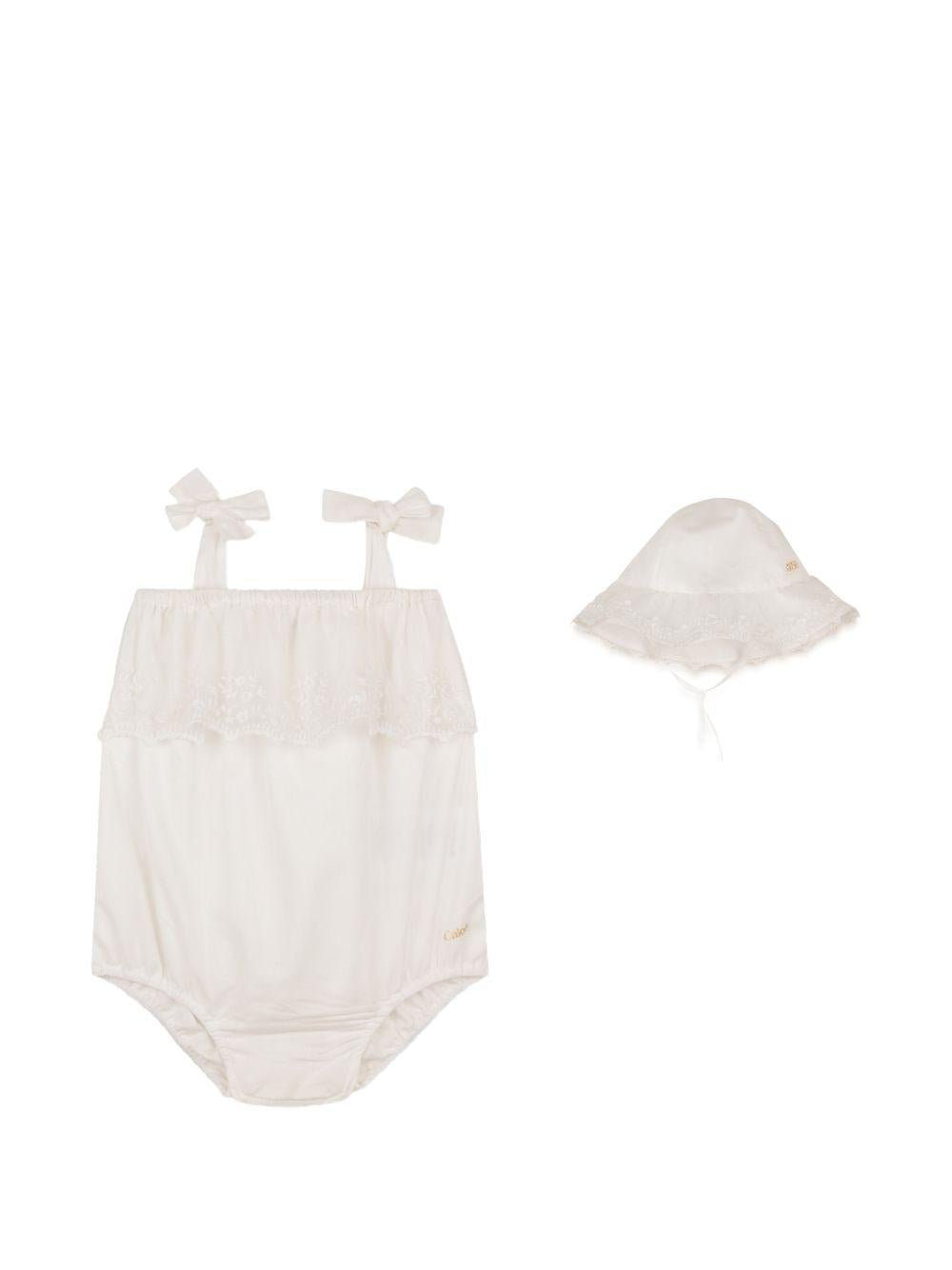Set tutina e capellino per neonata Chloé Kids bianco con finiture in pizzo - Rubino Kids