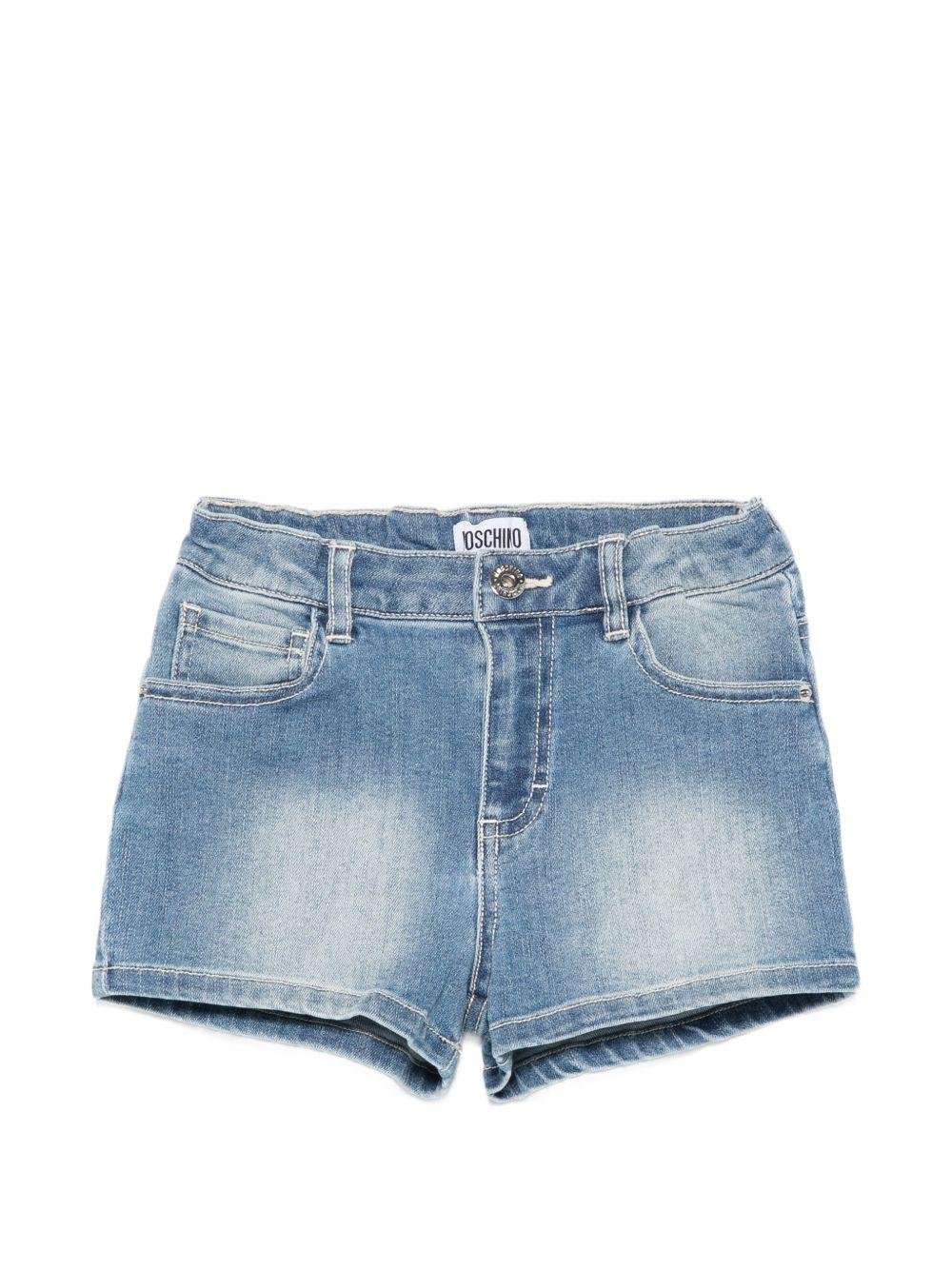 Shorts per bambina Moschino Kids in denim con stampa grafica sul retro - Rubino Kids