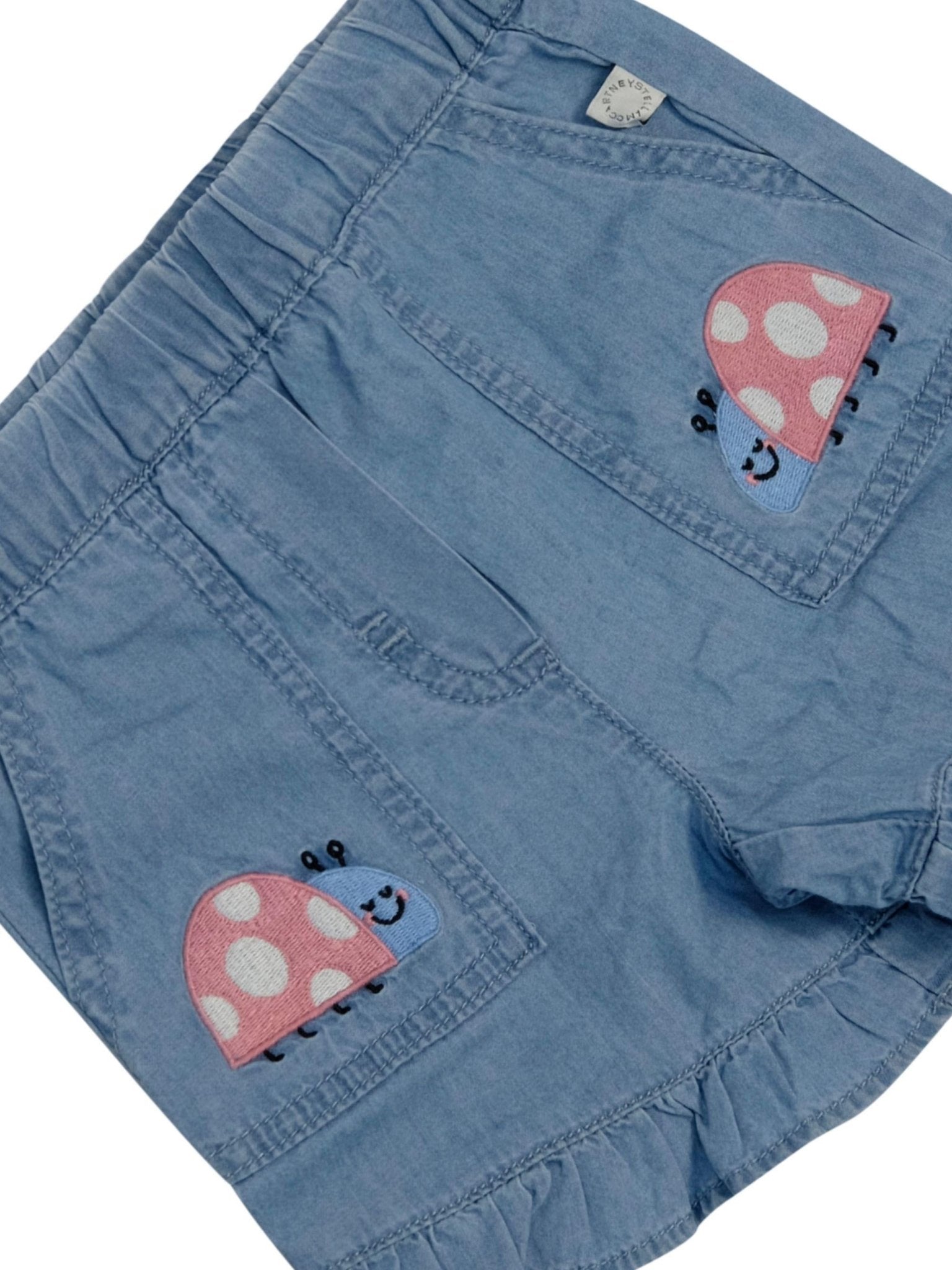 Shorts per neonata Stella McCartney Kids denim con stampa coccinelle - Rubino Kids