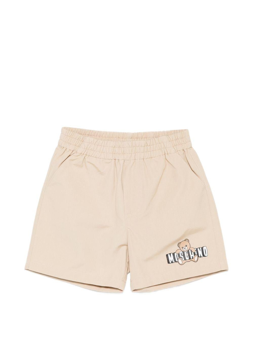 Shorts per neonati Moschino Kids beige con logo sul davanti - Rubino Kids