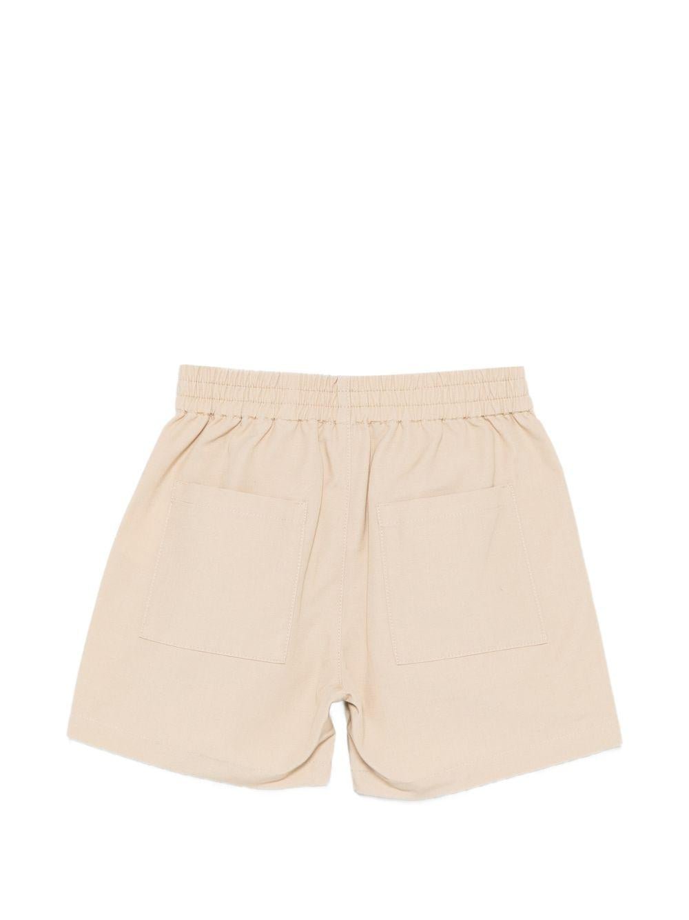 Shorts per neonati Moschino Kids beige con logo sul davanti - Rubino Kids