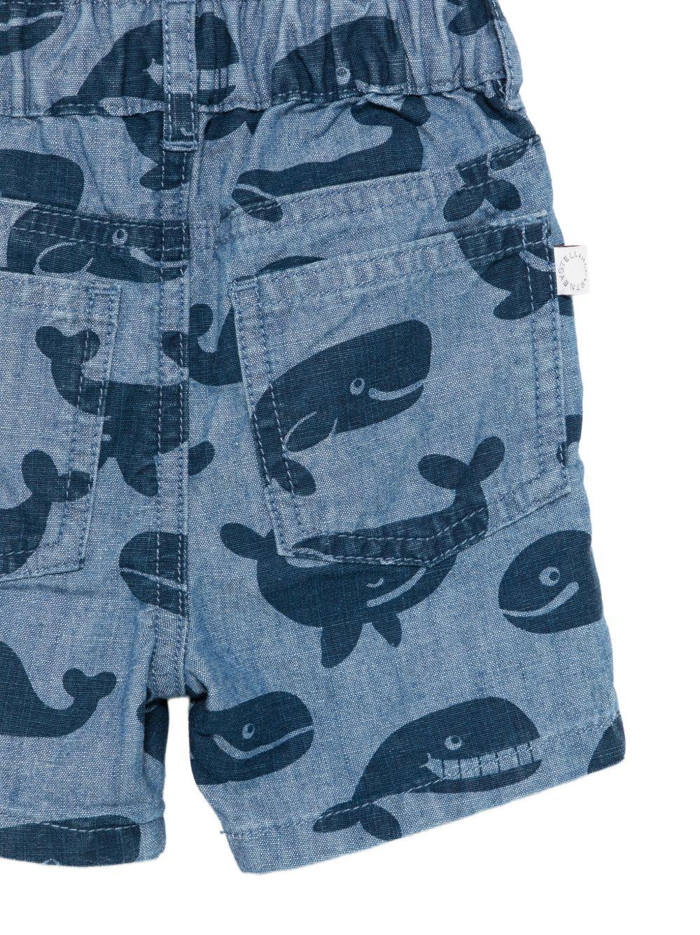 Shorts per neonato Stella McCartney Kids in denim con stampa balene - Rubino Kids