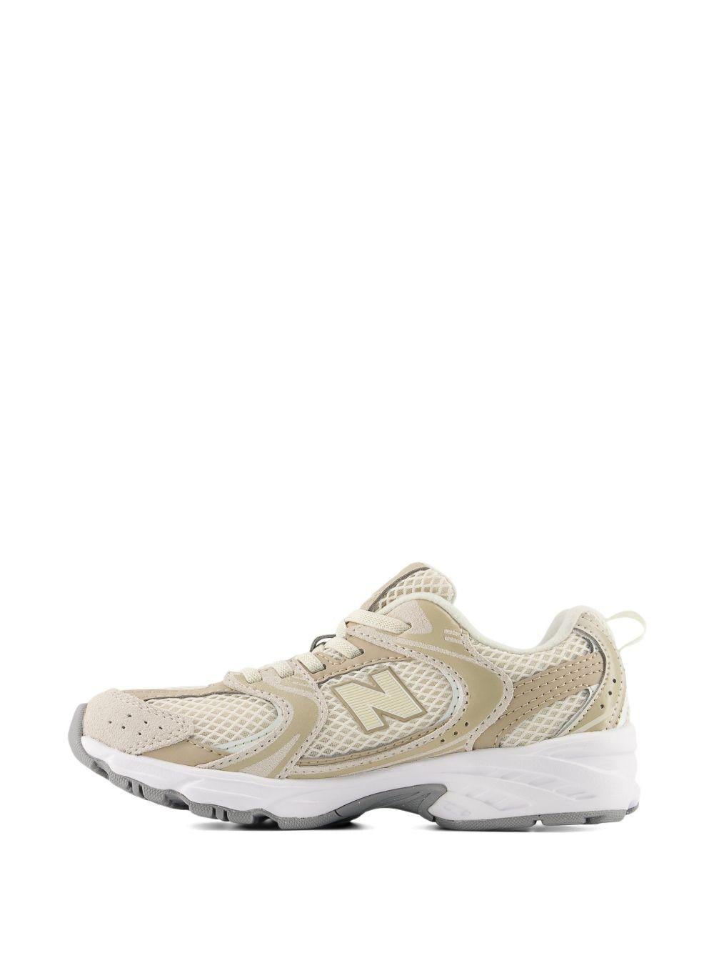 Sneakers 530 per bambini New Balance Kids beige con logo sulla linguetta - Rubino Kids